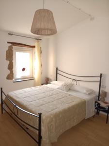 A bed or beds in a room at Alloggio Turistico Civico 4