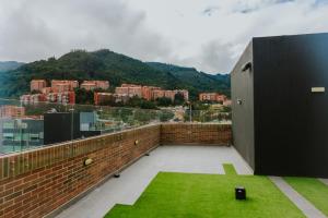 a balcony with a view of a city at Mini loft en Usaquén cerca la Fundación Santa Fe in Bogotá