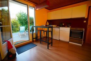 a kitchen with a table in the middle of it at Gite MontBlanc in Verrens-Arvey