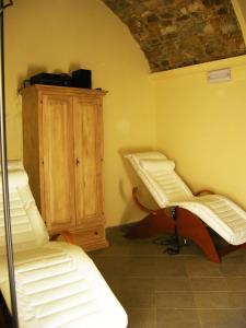 Ein Bett oder Betten in einem Zimmer der Unterkunft Relais Villa Sensano