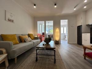 a living room with a couch and a table at Baiona Curuxa in Baiona