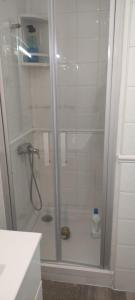 a shower with a glass door in a bathroom at Baiona Curuxa in Baiona +7 photos