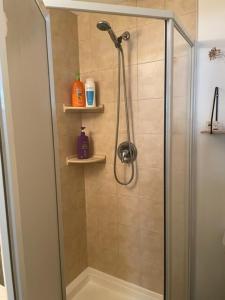 a bathroom with a shower with a glass door at Entire Apartment in Guelph +20 photos