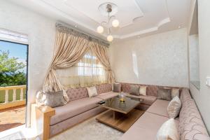 Posezení v ubytování Magnifique appartement avec jardin en face de la mer