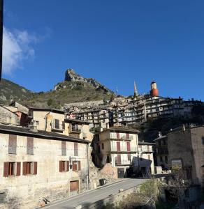 a view of a city with a mountain in the background at Beautiful apartment in Tende Vallée des Merveilles in Tende +8 photos