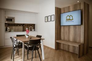 a kitchen and dining room with a table and chairs at Incao Holiday Corso Umberto I in Cefalù