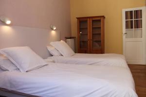 Postel nebo postele na pokoji v ubytování Les loges de la suite