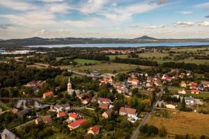 an aerial view of a small town with a lake at Bike ApartHouse 44 in Radomierzyce +3 photos
