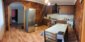 A kitchen or kitchenette at Kamara Guest House