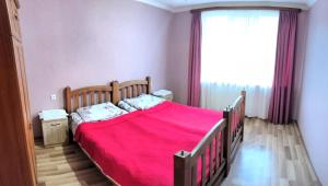 A bed or beds in a room at Kamara Guest House
