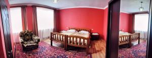 A bed or beds in a room at Kamara Guest House