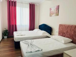 Postel nebo postele na pokoji v ubytování SARVI Apartments