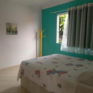 Ένα ή περισσότερα κρεβάτια σε δωμάτιο στο Alta baixa temporada