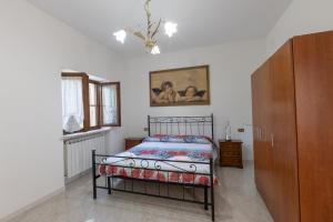 En eller flere senge i et værelse på Agriturismo Sant'Adriano