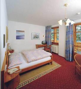 Postel nebo postele na pokoji v ubytování Hotel Waldheim Belvedere