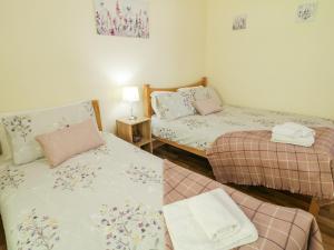 Postel nebo postele na pokoji v ubytování Tullyally