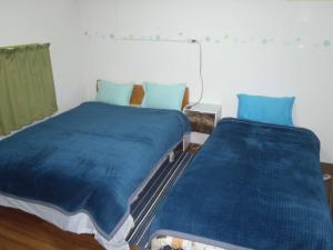 Ένα ή περισσότερα κρεβάτια σε δωμάτιο στο Mike's B&B Tokoname