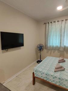 Postel nebo postele na pokoji v ubytování Villa Skanderbeg Guest House Talaudyong Beach