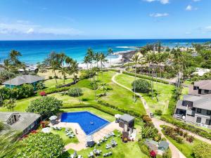 an aerial view of a resort with a swimming pool and the beach at Kauai Manualoha 703 by Coldwell Banker Island Vacations in Kipu