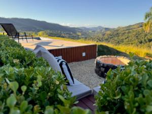 a backyard with a couch and a fire pit at Exclusive Cabanas in Serra Negra