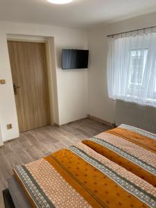 Postel nebo postele na pokoji v ubytování Apartmány Ferie
