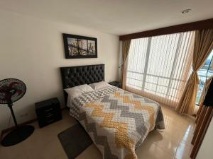 Ένα ή περισσότερα κρεβάτια σε δωμάτιο στο apartamentos ejecutivos +63 φωτογραφίες