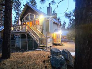 a large house with a porch and stairs on it at 3BR Home w Game Room by The Village, Lake & Summit in Big Bear Lake