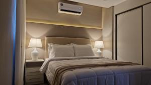 Llit o llits en una habitació de ABIBA Apart-Hotel & SPA