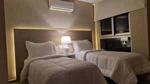 Llit o llits en una habitació de ABIBA Apart-Hotel & SPA