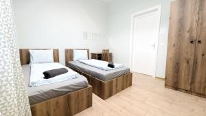 Postel nebo postele na pokoji v ubytování Spacious Rooms - 15 Min from Airport & City Center, 5 Min from Vienna Main-Bus Station EZ9