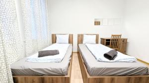 Postel nebo postele na pokoji v ubytování Spacious Rooms - 15 Min from Airport & City Center, 5 Min from Vienna Main-Bus Station EZ9 + 24 fotografií