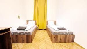 Postel nebo postele na pokoji v ubytování Spacious Rooms - 15 Min from Airport & City Center, 5 Min from Vienna Main-Bus Station EZ9