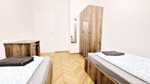Postel nebo postele na pokoji v ubytování Spacious Rooms - 15 Min from Airport & City Center, 5 Min from Vienna Main-Bus Station EZ9