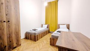 Postel nebo postele na pokoji v ubytování Spacious Rooms - 15 Min from Airport & City Center, 5 Min from Vienna Main-Bus Station EZ9
