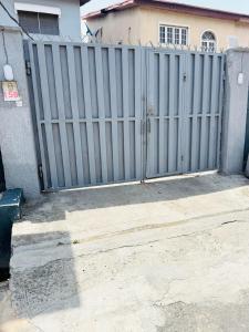 a metal gate in front of a house at Pearl Homes in Maryland