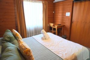 Cama ou camas em um quarto em Hotel El Coihue