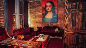 a living room with a couch and a brick wall at Broadway Penthouse 4br 3bth 2500 SF in Nashville