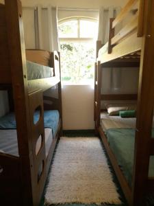 Postel nebo postele na pokoji v ubytování Jungla Hostel