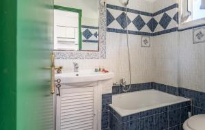 a bathroom with a sink and a tub and a toilet at Dolce Vita Residence in Kalamaki +24 photos