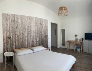 A bed or beds in a room at Sunrise