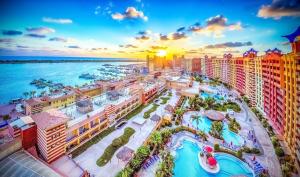 an aerial view of a resort with a pool at بورتو مارينا in El Alamein
