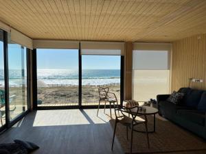 a living room with a view of the ocean at Paraiso junto al mar in Coquimbo