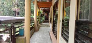 a hallway of a house with a walkway at Twin hearts Resort Pool Cabin 3 in Jasaan