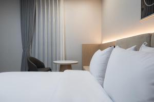 Postel nebo postele na pokoji v ubytování Hound hotel gunsan