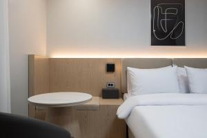 Postel nebo postele na pokoji v ubytování Hound hotel gunsan