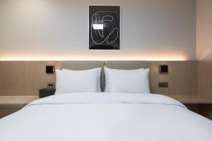 Postel nebo postele na pokoji v ubytování Hound hotel gunsan