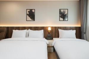 Postel nebo postele na pokoji v ubytování Hound hotel gunsan