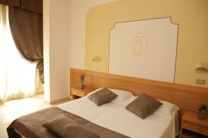 Voodi või voodid majutusasutuse Hotel Jolie toas