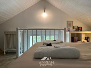 Postel nebo postele na pokoji v ubytování Maisonnette avec climatisation et cour - ménage et linge inclus