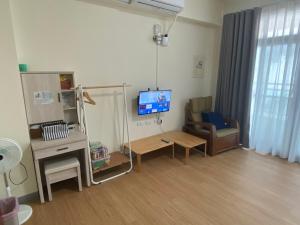 Telewizja i/lub zestaw kina domowego w obiekcie 吾居竹山民宿